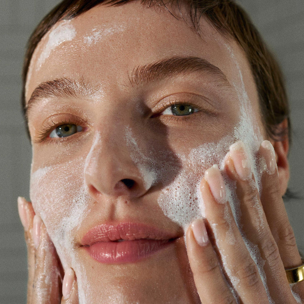Dermalogica Daily Microfoliant — model applying brightening exfoliant