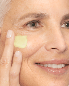 A woman using Dermalogica retinol cream